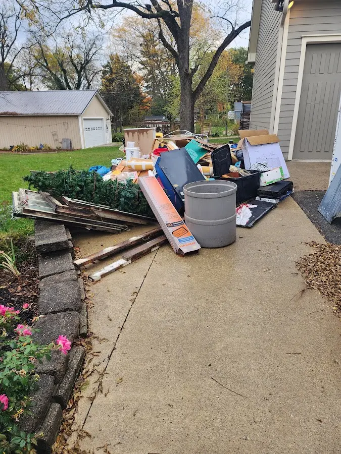 Dumpster being loaded with debris for 30 Yard Dumpster Rental in Grasonville